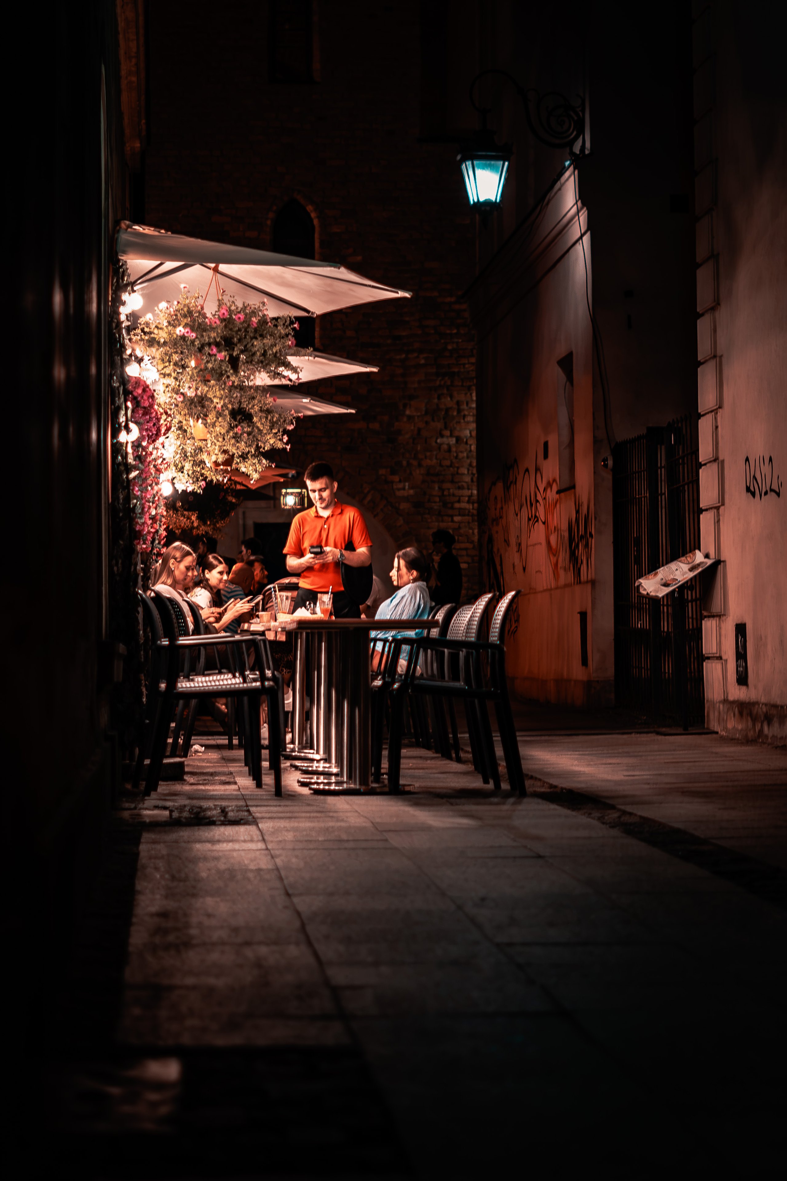 Restaurant dining in a lit alleyway