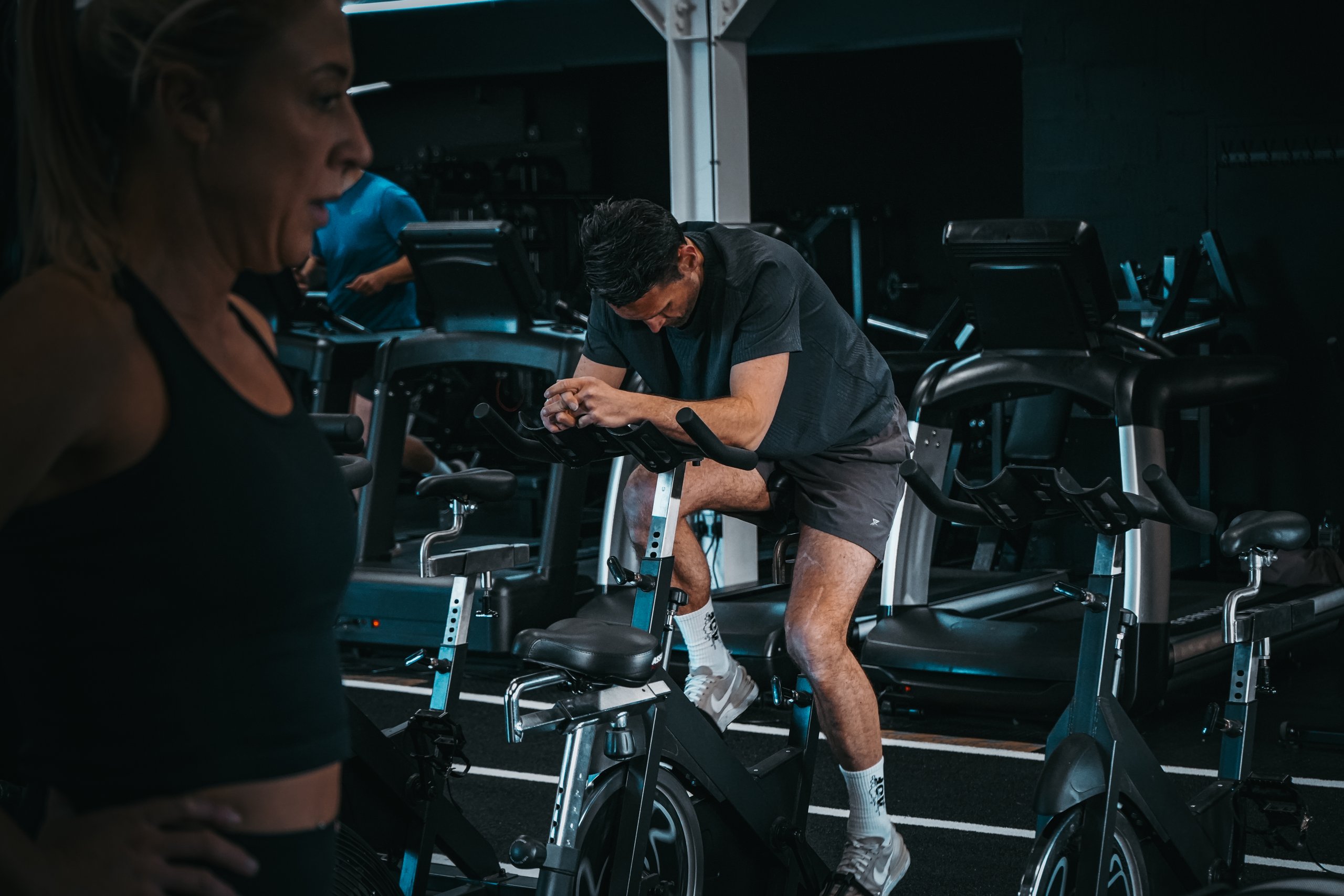 Man pushing himself on spin bike