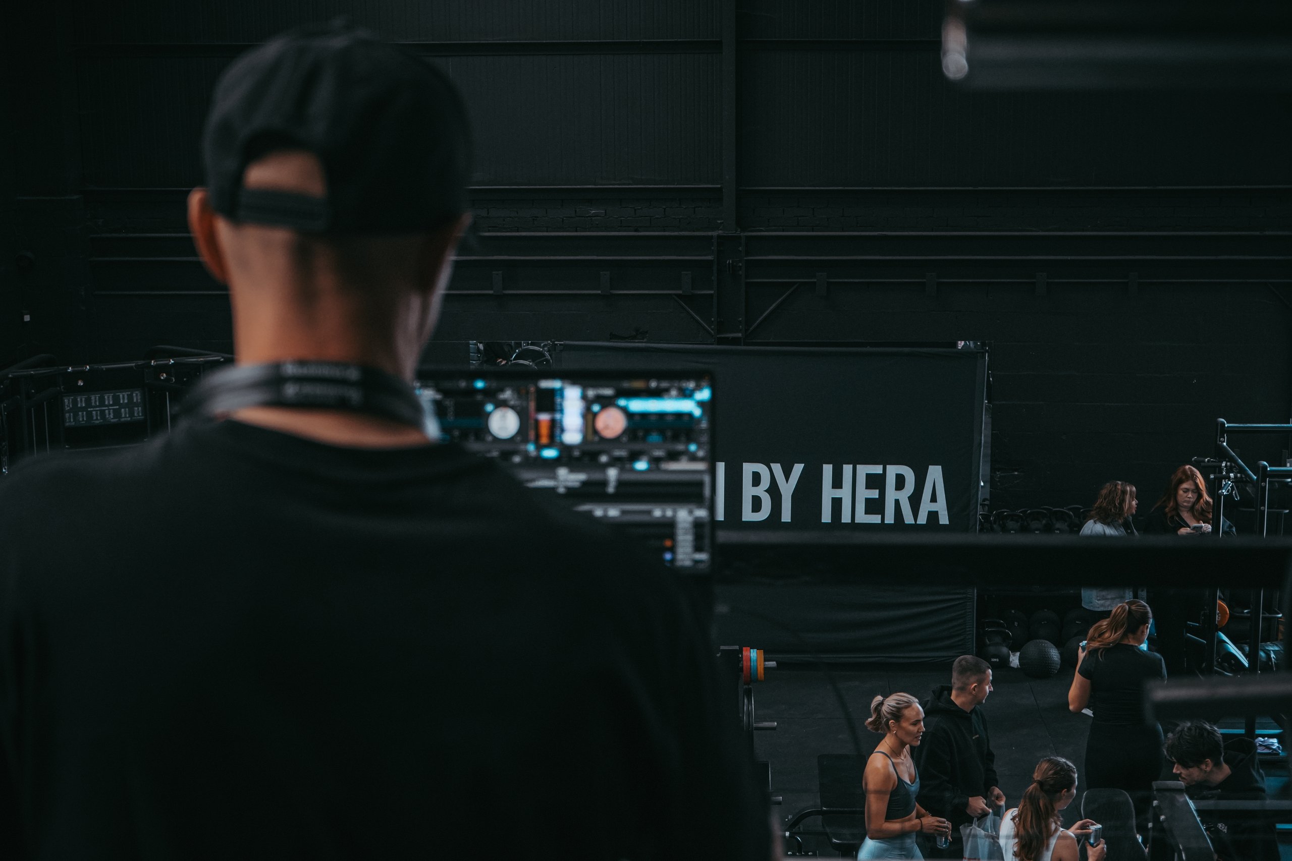 DJ overlooking workout floor